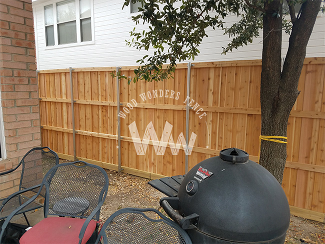 Cedar board-on-board fence with steel posts